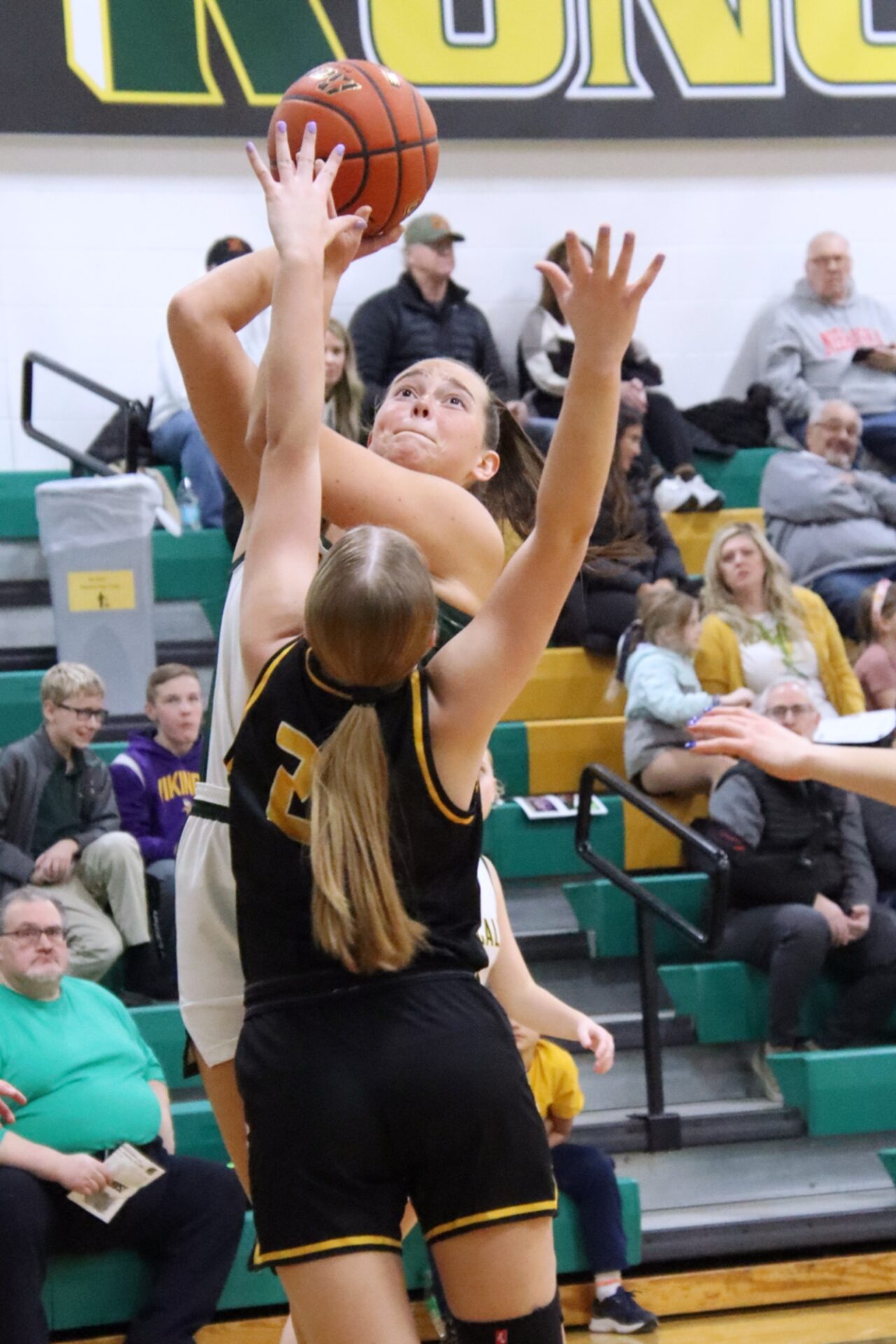Aberdeen Roncalli's Ava Hanson takes a jump shot over Faulkton Area's Carley Cotton during the first quarter of the Cavaliers' Tuesday, Jan. 14 victory at the Roncalli Gym. Aberdeen Insider photo by Allie Hoekman.