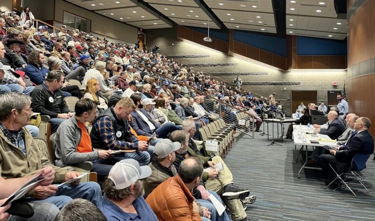 Hundreds of people fill the Southeast Technical College auditorium in Sioux Falls for a Public Utilities Commission hearing about a carbon dioxide pipeline proposal on Jan. 15. South Dakota Searchlight photo by Makenzie Huber.