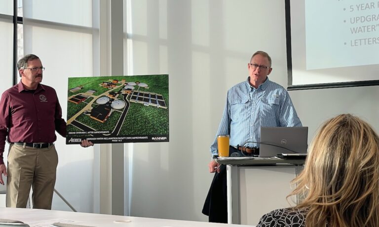 City Manager Robin Bobzien, left, holds up a diagram illustrating the proposed improvements to the city's water reclamation plant during a talk featuring Public Works Director Stu Nelson. Construction of the new public works building is expected to begin this year. Aberdeen Insider photo by Elisa Sand.