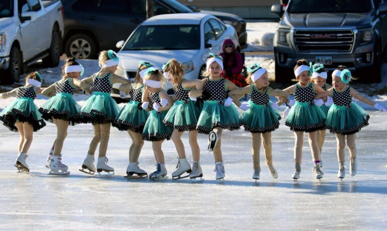 Members of the 2024 kindergarten skating group, which included Maya Anderson, Ivy Cole, Layla Feist, Emersyn Giedt, Molly Swisher, Kayleigh Raba, Collins Traphagen, Aubrie Traphagen, Sunny Washenberger, Nova Washenberger, Harper Cleveland and Kaylee Hofer, move in a line during the Sunday afternoon Carnival of Silver Skates performance at the outdoor ice skating rink in Groton. Photo courtesy of Elizabeth Varin.