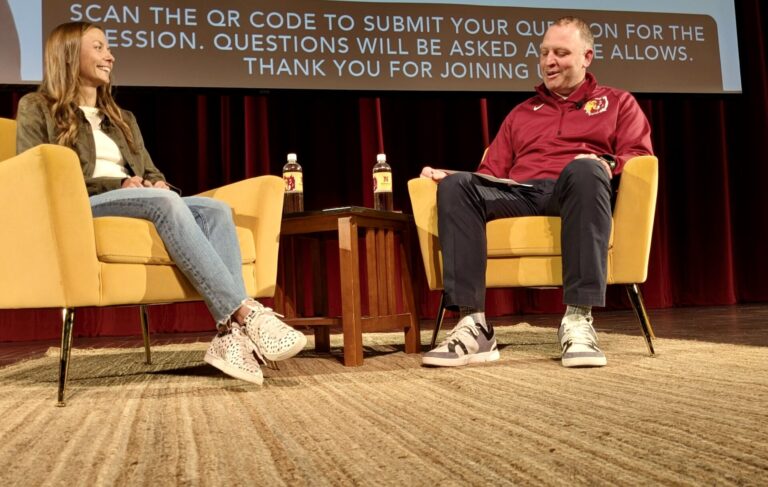 Olympic marathoner Dakotah Lindwurm, left, and Nate Davis, NSU director of athletics, visit during a question-and-answer session Thursday, Jan. 23 at the Johnson Fine Arts Center on the Northern campus. Aberdeen Insider photo by Scott Waltman.