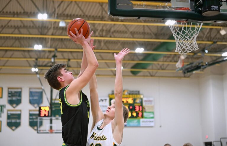 Aberdeen Roncalli's Parker Grieben goes up for a jump shot over Northwestern's Dallas Stoltenberg during the third quarter of their game Friday, Jan. 24 in Mellette. Aberdeen Insider photo by Robb Garofalo.
