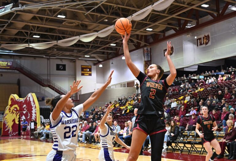 Northern State's Maddie Bragg takes a jump shot over winona State's Vivica Bretton in the first quarter of their game Saturday, Jan. 25 inside Wachs Arena during I Hate Winter weekend. Aberdeen Insider photo by Robb Garofalo.