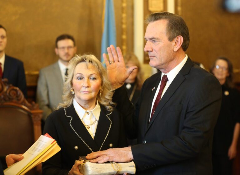 Larry Rhoden is sworn in as governor of South Dakota on Monday, Jan. 27, at the state Capitol Pierre as his wife, Sandy, stands to the left. South Dakota Searchlight photo by Joshua Haiar.