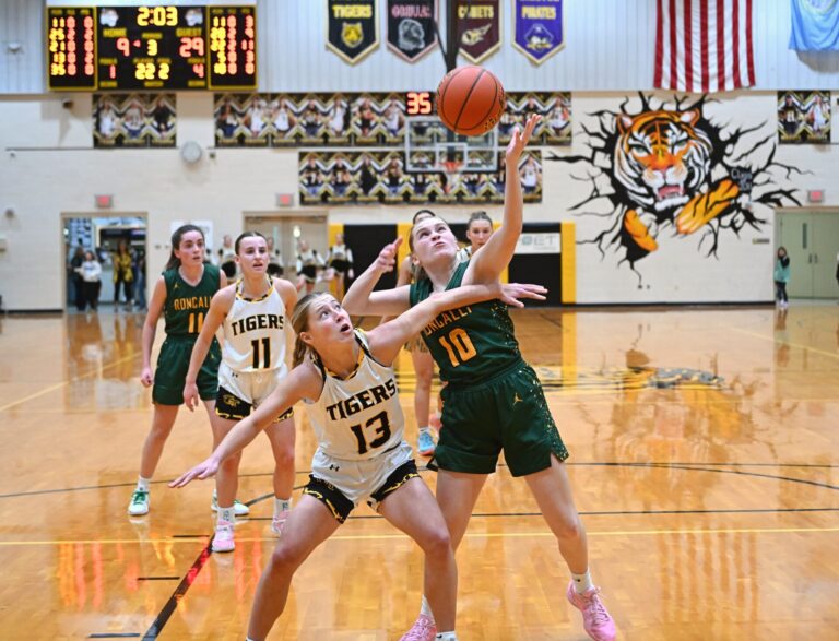 Aberdeen Roncalli's Morgan Helms battles Groton Area's Laila Roberts for a rebound during the third quarter of their game Tuesday, Jan. 28 in Groton. The Cavaliers won 38-24. Aberdeen Insider photo by Robb Garofalo.