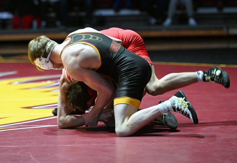 Northern State's Braydon Mogle tries to turn St. Cloud State's Aleyus Craig during their 141-pound match Friday, Feb. 7 inside Wachs Arena. Mogle, ranked No. 12, defeated No. 13 Craig in a decision. Aberdeen Insider photo by Robb Garofalo.