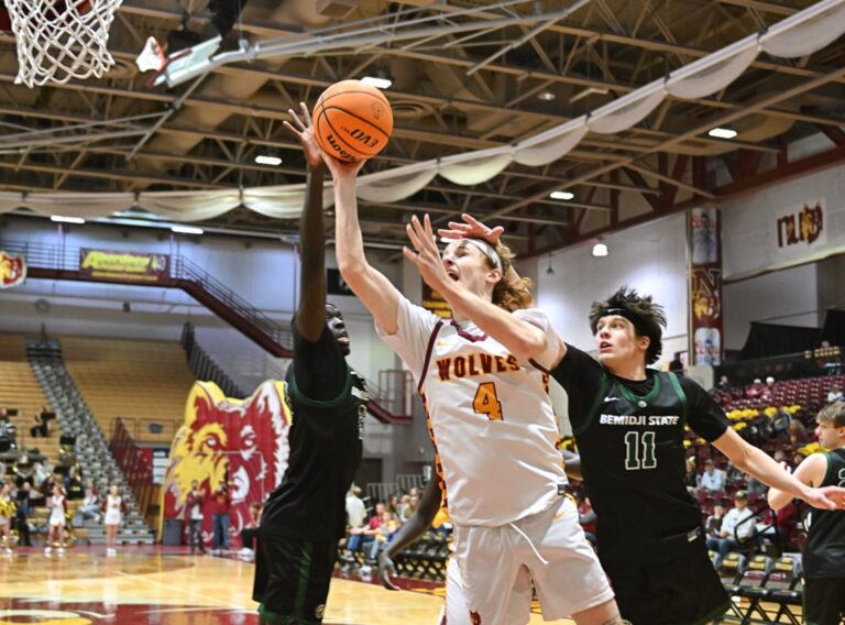 Northern State's James Glenn drives and scores two of his 16 points despite Bemidji State's John Pecarich's hand hitting Glenn's head in the first half of their game Saturday, Deb. 8 inside Wachs Arena. Aberdeen Insider photo by Robb Garofalo.