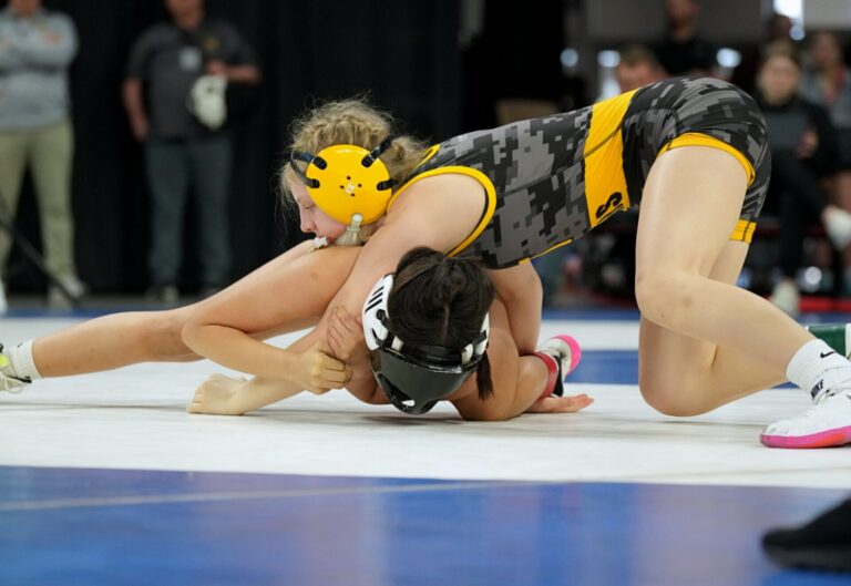 Groton Area's Liza Krueger holds her opponent down during last year's state wrestling tournament. Krueger finished third, but is the top seed at 100 pounds entering this year's tournament In Rapid City. Photo courtesy of South Dakota Public Broadcasting.