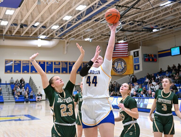 Aberdeen Central's Taryn Hermansen goes over Sioux Falls Jefferson's Brinley Altenburg for two of her game-high 21 points during their Class AA SoDak 16 game Friday, March 7 at Golden Eagles Arena. Central lost the game 57-54 on a buzzer-beating three-pointer. Aberdeen Insider photo by Robb Garofalo.