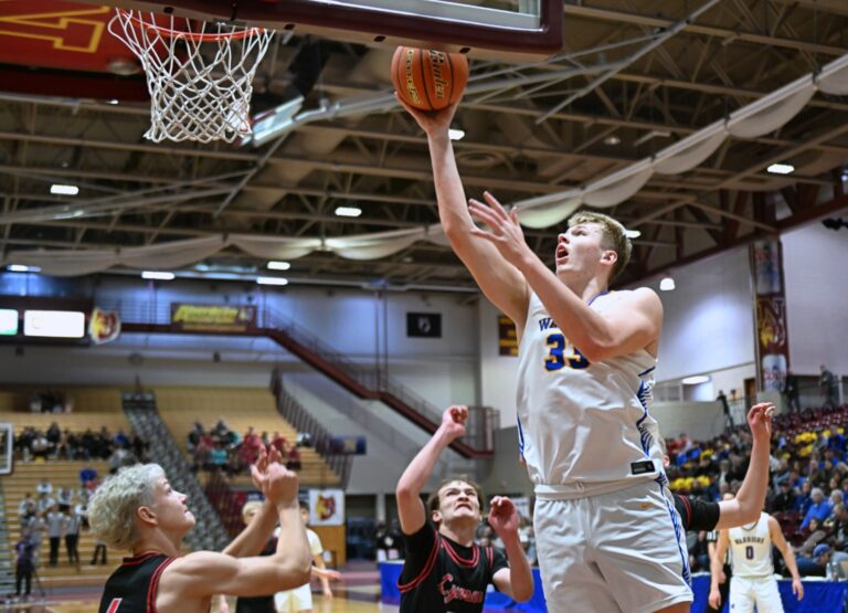 Castlewood's Bryon Laue lays in two of his 12 points during a 64-38 win over Lyman in the quarterfinal of the Class B boys state tournament Thursday, March 20 inside Wachs Arena. Laue added 11 rebounds for a double-double in the top-seed's win. Aberdeen Insider photo by Robb Garofalo.