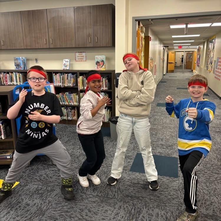 Number Ninjas members at O.M. Tiffany can earn different colored belts as they master math skills. Showing off their red belts are, from left, fifth-graders Jackson Lemire, Shane Leroy, Paige Fletcher and Bryant Linke. Courtesy photo.