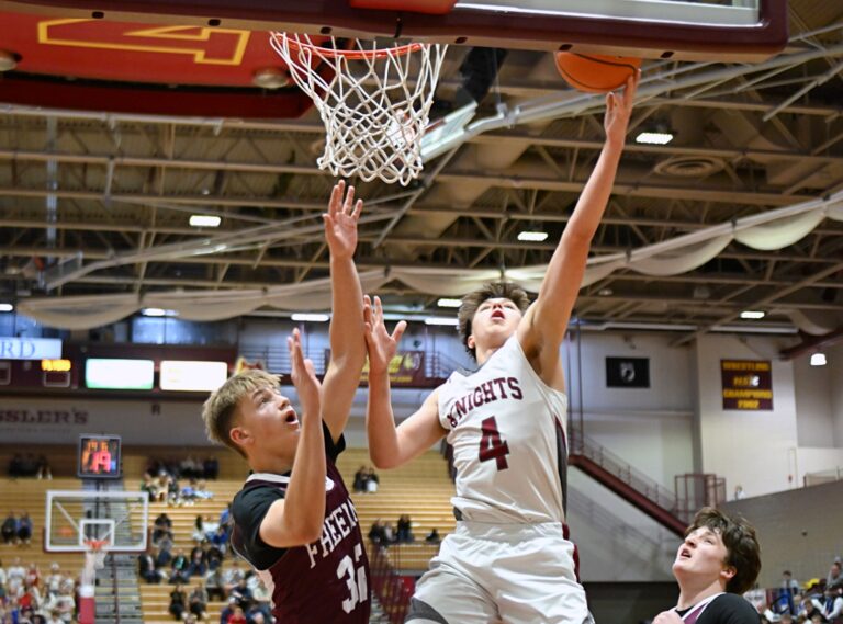 Aberdee Christian's Brooks Jett drives to the hoop on Freeman's Oliver Waltner during a State B tournament game Friday, March 21 at Wachs Arena. Jett was named to the Class B all-state boys basketball third team. Aberdeen Insider photo by Robb Garofalo.