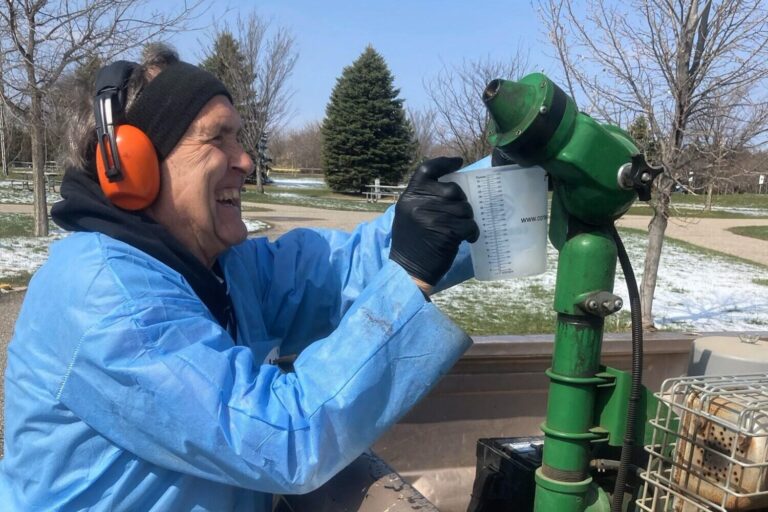 Tom Hedrick calibrates a mosquito fogger for the city of Groton. Groton Independent photo by Paul Kosel.