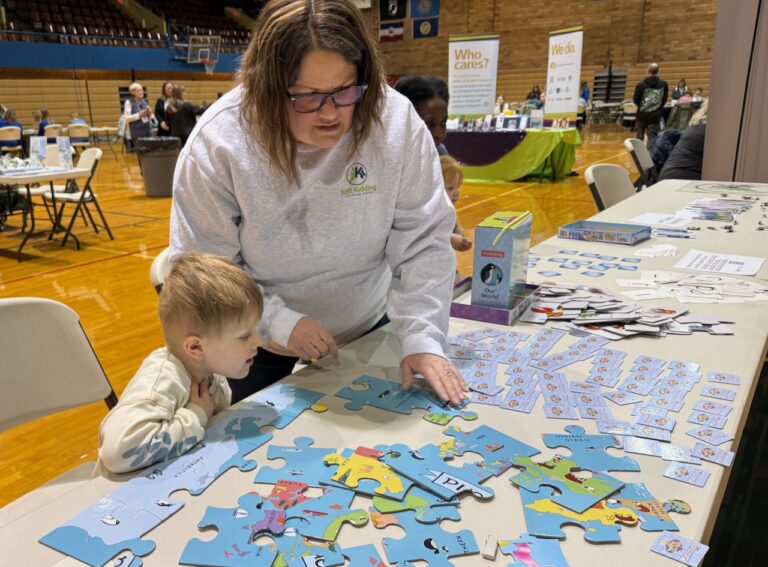 Baldur Grotjohn, 4, spends time with Kari Brown assembling a puzzle during the Early Learner event on Monday, March 31 at the Aberdeen Civic Arena. The puzzle activity was one of several available for young kids. Aberdeen Insider photo by Elisa Sand.