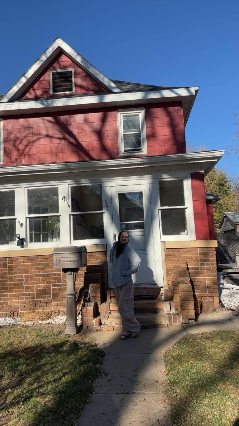 Bailey Aberle stands in front of her newly purchased home in Aberdeen. She is a first-time homeowner. She said she had to get her financial affairs in order to afford the house. Courtesy photo.