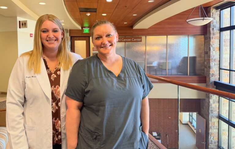 Sanford Health physicians assistant Angela Williams, left, stands with radiation technician Nicole Hohle, who is nearing the end of cancer treatment after doctors discovered she had Stage 3 colon cancer. Aberdeen Insider photo by Elisa Sand.