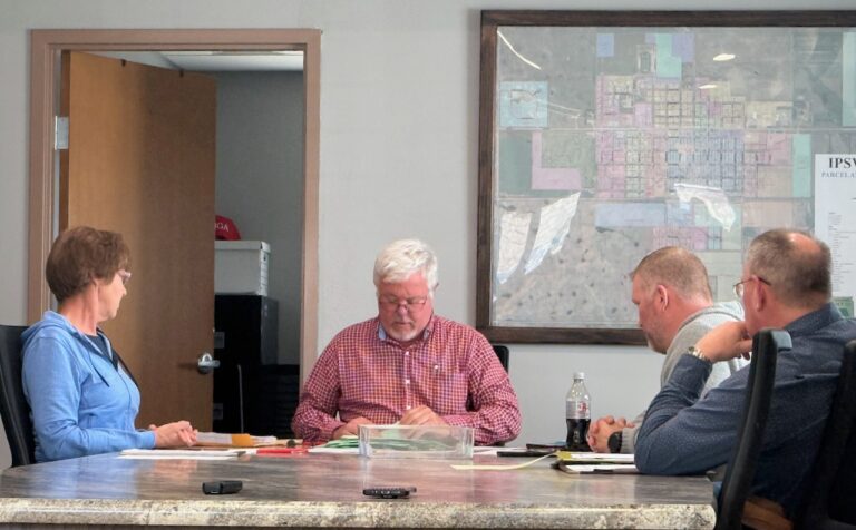 The Ipswich Ward 1 recount board composed of, from left, Susie Trefz, Scott Moore and Aaron Walberg sit with Ipswich City Attorney Vaughn Beck to complete a recount on Wednesday, April 16 at the city office. Aberdeen Insider photo by Elisa Sand.