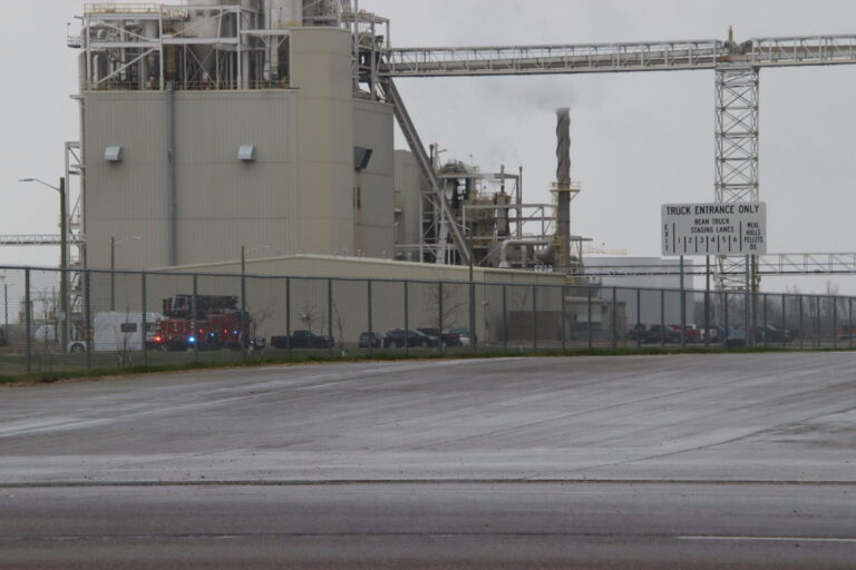 A fire truck is stationed near AGP as crews put out a grass fire near the soybean processing plant on the northeast edge of town. Aberdeen Insider photo by Shannon Marvel.