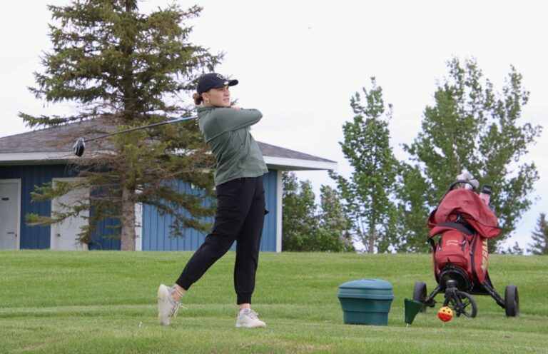 Aberdeen Roncalli's Morgan Helms watches her tee shot during last year's Region 1A tournament in Groton. The Cavaliers return their top six golfers this season. Aberdeen Insider photo by Rob Garofalo.