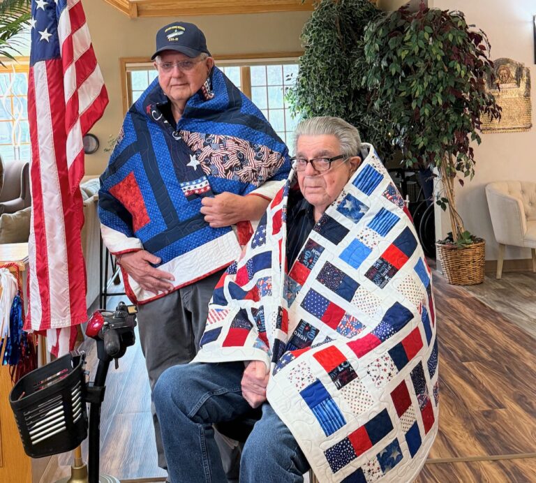 Navy veterans and brothers Roger Schaible, left, and Harvey Schaible both received a Quilt of Valor Thursday, April 24 at Davis Court Apartments. They are among seven brothers who served in the military. Aberdeen Insider photo by Elisa Sand.