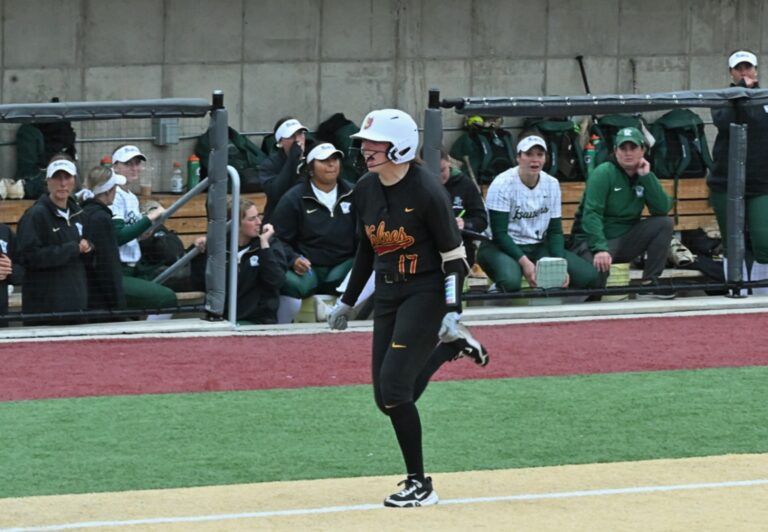 Northern State's Avaire Eagle approaches home plate while a stunned Bemidji State dugout watches after Eagle's three-run home run ended the game Sunday, April 27 at Koehler Hall of Fame Field. The Wolves trailed by seven runs before rallying to win 8-7. Aberdeen Insider photo by Robb Garofalo.