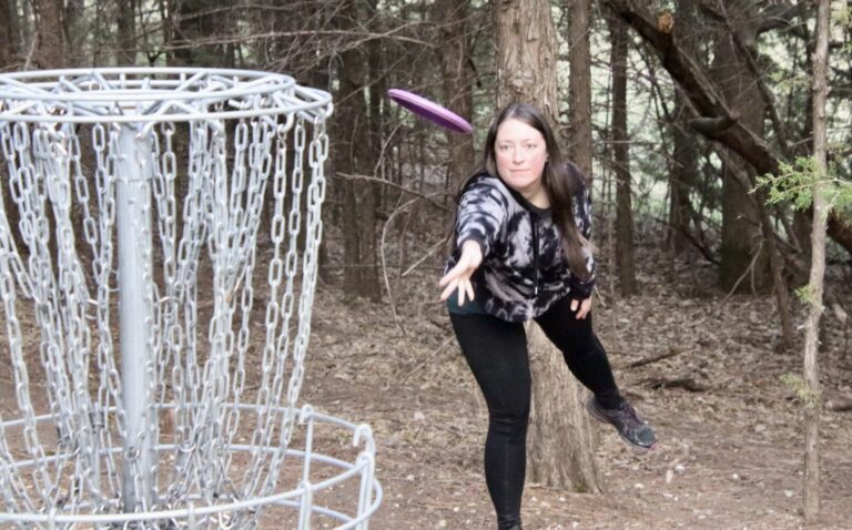 Jocelyn Craig attempts a shot on the first night of women's disc golf league play on Wednesday, April 23 at Richmond Lake Recreation Area. Aberdeen Insider photo by Shannon Marvel.