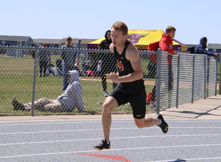 Aberdeen native and Northern State sprinter Chris Weber begins the 400-meter relay at the 2024 Dewey Donat Classic in Aberdeen. Aberdeen Insider photo by Robb Garofalo.