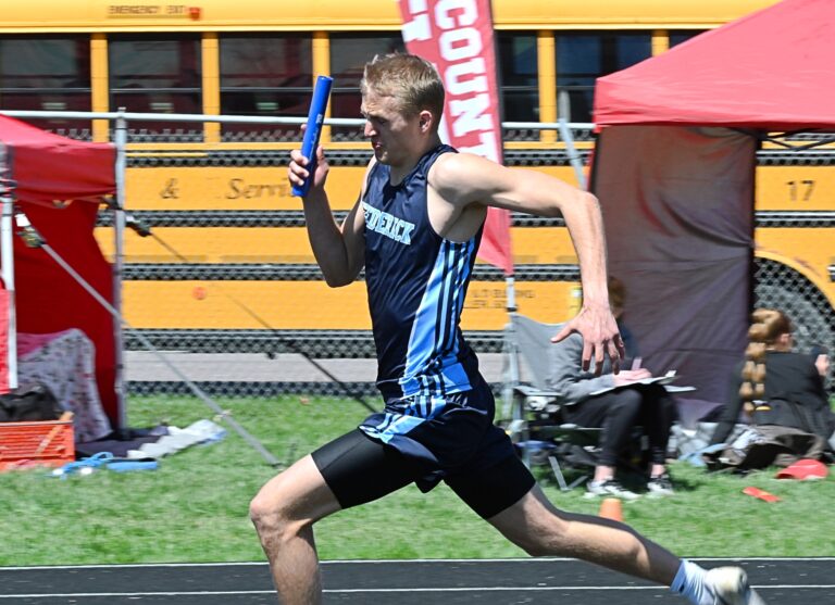 Frederick Area's Noah Kippley runs the second leg of the 800-meter relay at the Rob Luecke Invitational Tuesday, April 29 in Groton. Kippley helped the Titans to a third-place finish. Aberdeen Insider photo by Robb Garofalo.