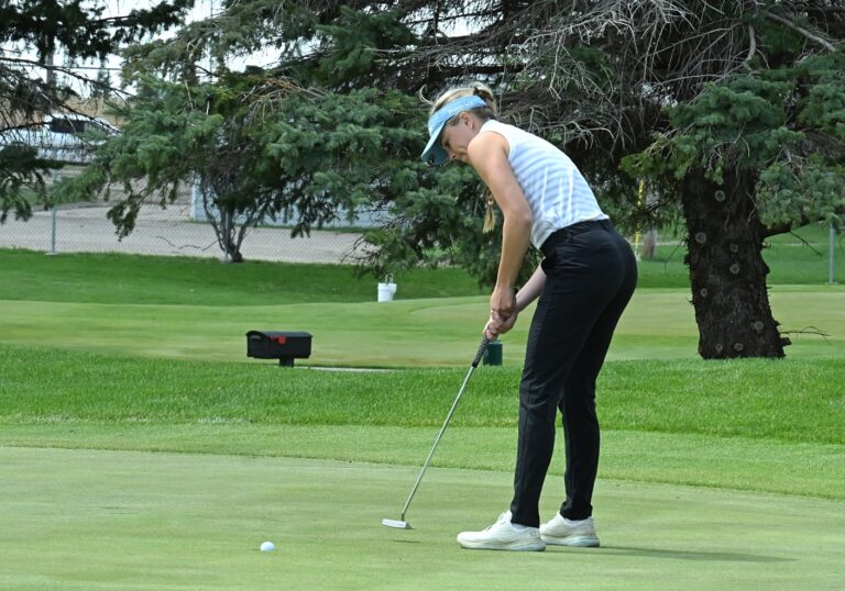 Aberdeen Central's Olivia Braun rolls in her putt for par on the 18 hole during the Hub City Invitational Thursday, May 1 at Lee Park Golf Course. Braun would card a one-under 71 to win medalist honors. Aberdeen Insider photo by Robb Garofalo.
