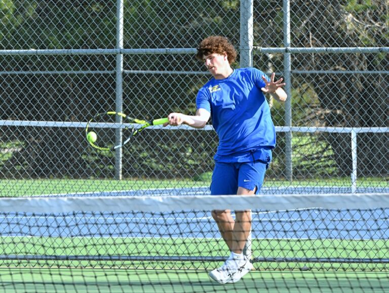 Aberdeen Central's AJ Prehn hits a forehand during his match against Roncalli's Gannon May on Tuesday, May 6 at Holgate Middle School. Prehn's victory helped the Eagles to a 9-0 triumph. Aberdeen Insider photo by Robb Garofalo.