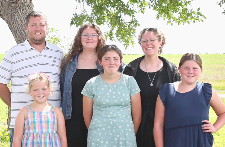 Rosemary Price, center back, graduated from Northern State University on May 10 with a master's degreed in education studies through the state's Teacher Apprenticeship Pathway program. Courtesy photo.