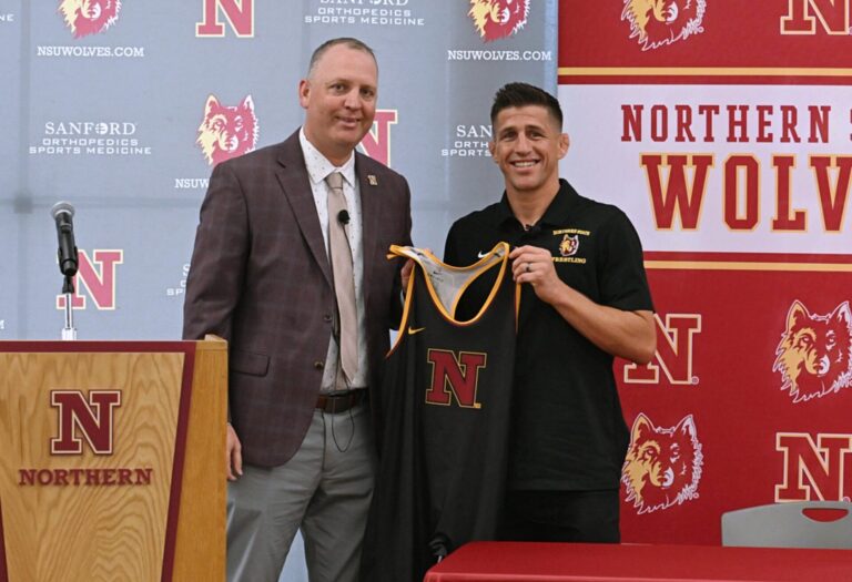 Northern State Athletic Director Nate Davis, left, introduces Josh Nolan as the new head wrestling coach Wednesday, May 14 in the Kessler's Champions Club Room at the Barnett Center. Aberdeen Insider photo by Robb Garofalo.