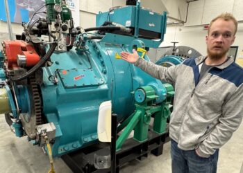 Matthew Pearson, an instructor in the wind technology program at Mitchell Tech in Mitchell, shows a turbine students can work on in a lab at the school on April 8. South Dakota News Watch photo by Bart Pfankuch.