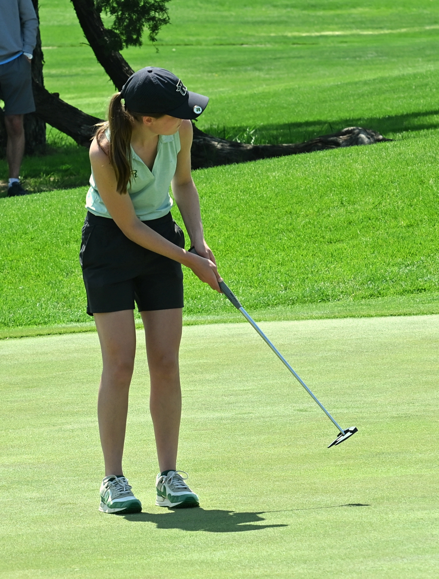 Claire Crawford tracks her putt on the par-four 18th hole during the Roncalli Invite. Crawford won medalist honors at the Region 1A tournament Thursday, May 22 on a second playoff hole. Aberdeen Insider photo by Robb Garofalo.
