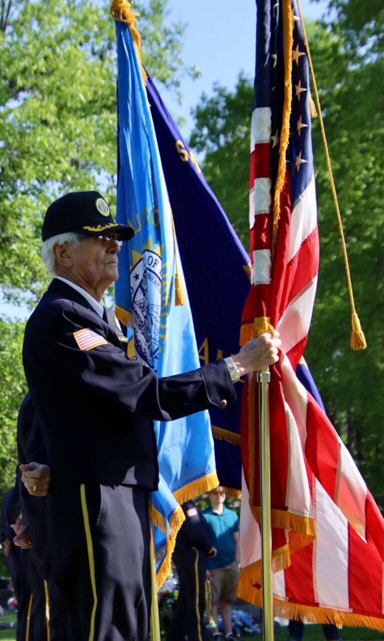 Larry Lightenburg with the American Legion color guard holds the U.S. flag during the Memorial Day ceremony at St. Mary's Cemetery on Monday, May 28. Aberdeen Insider photo by Scott Waltman.