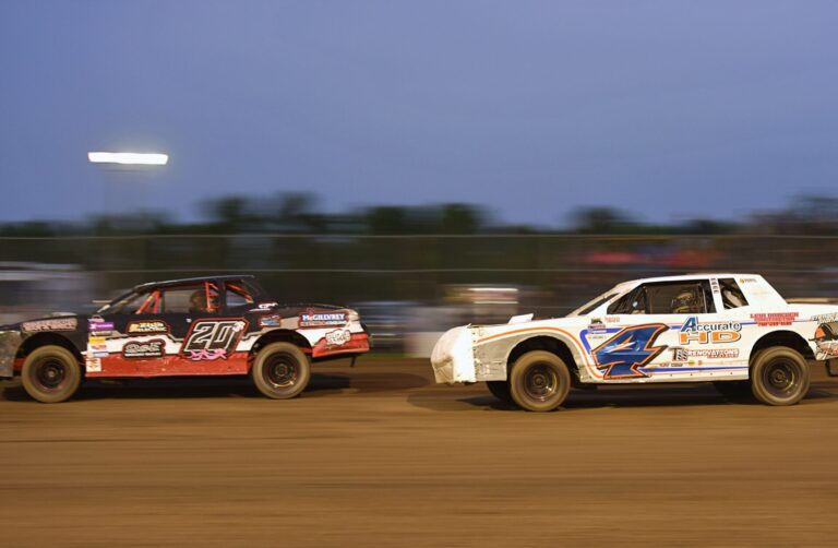 Huron's Jayden Bogh passes Grand Forks, N.D., racer Trey Hess after a restart with three laps to go to win the Street Stock feature race Friday, May 29 at the Brown County Speedway. Aberdeen Insider photo by Robb Garofalo.