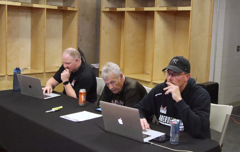 Aberdeen Wings head coach Scott Langer, right, owner Greg Odde and president Aaron Smith track the opening round of the North American Hockey League Draft Wednesday, June 11 inside the Wings locker room at the Odde Ice Center. Aberdeen Insider photo by Robb Garofalo.