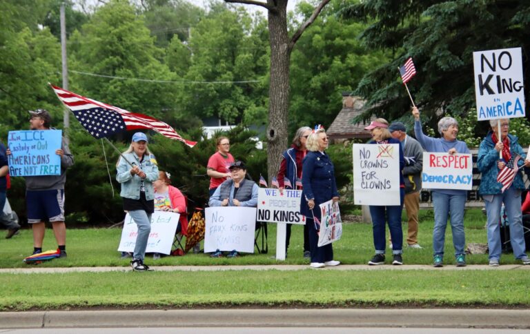 Residents opposed to the policies and perceived authoritarian tendencies of President Donald Trump gathered for a No Kings rally Saturday, June 14 at Anderson Park along Sixth Avenue Southeast. About 135 people were on hand and peacefully protesting around 12:30 p.m. Many passing motorists, encouraged by signs, honked in support. The Aberdeen event, organized by Indivisible Aberdeen, was one of many nationwide. The protests were organized in response to a military parade on Saturday in Washington, D.C., coinciding with Trump’s 79th birthday and the U.S. Army’s 250th anniversary. Aberdeen Insider photos by Scott Waltman.
