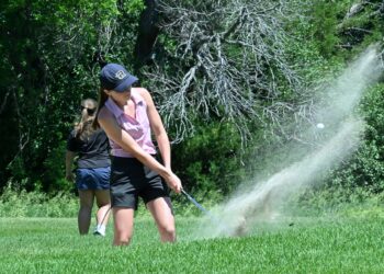 Aberdeen Roncalli's Claire Crawford blasts out of the bunker on the par-three 17th hole during the South Dakota Golf Association Sanford Junior Tour event at Moccasin Creek County Club on Monday, June 23. Crawford won the 16-18 year-old girls division with a 93. Aberdeen Insider photo by Robb Garofalo.