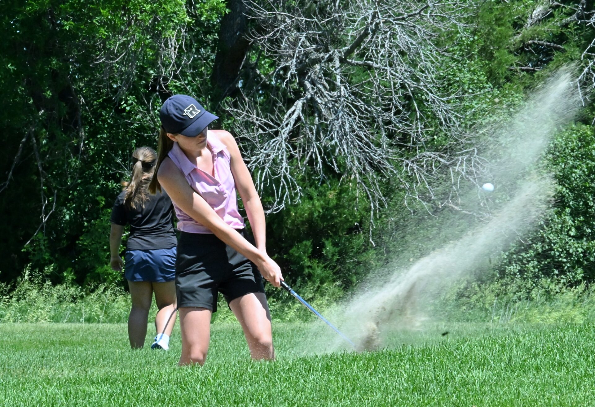 Aberdeen Roncalli's Claire Crawford blasts out of the bunker on the par-three 17th hole during the South Dakota Golf Association Sanford Junior Tour event at Moccasin Creek County Club on Monday, June 23. Crawford won the 16-18 year-old girls division with a 93. Aberdeen Insider photo by Robb Garofalo.