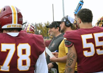 Northern State head football coach Mike Schmidt meets with his team during a timeout against Minnesota State Mankato on Saturday, Sept. 6, 2024 at Dacotah Bank Stadium. Aberdeen Insider photo by Robb Garofalo.