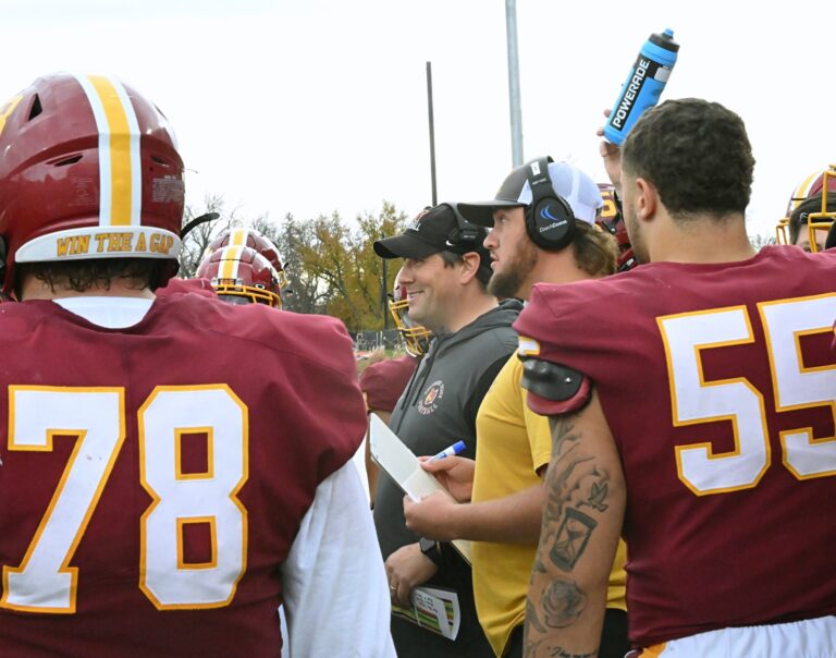 Northern State head football coach Mike Schmidt meets with his team during a timeout against Minnesota State Mankato on Saturday, Sept. 6, 2024 at Dacotah Bank Stadium. Aberdeen Insider photo by Robb Garofalo.