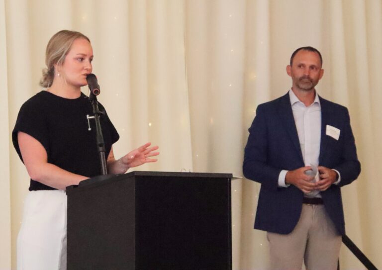 Samantha Wipf of Optimal Performance expresses her thanks after winning the Aberdeen Business Pitch Contest. At right is Tim Hanigan, CEO of the Aberdeen Development Corp. Aberdeen Insider photo by Elisa Sand.