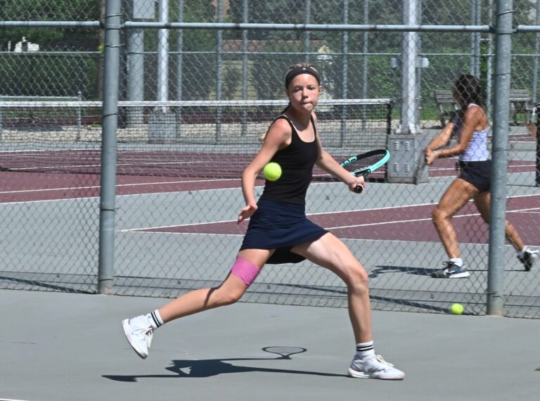 Aberdeen's Sarah Knie hits a running forehand during her match against Jenny Pitcher Tuesday, July 8 at the C.C Lee Open tennis tournament at the Northern State courts. Pitcher defeated Knie in straight sets. Aberdeen Insider photo by Robb Garofalo.