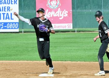 Aberdeen Smittys shortstop Grant Beyer steps on second and throws to first to complete a double play Tuesday, July 8 at Fossum Field. The Smittys split a doubleheader with Sioux Falls East, taking game one 15-9 before falling 18-3 in game two. Aberdeen Insider photo by Robb Garofalo.