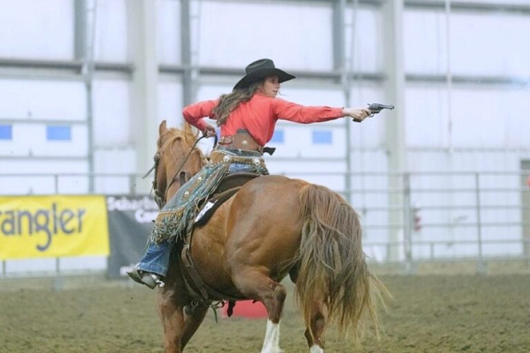 Groton's Taryn Thompson turns and fires during the Cowboy Mounted Shooting National Championship in Lincoln, Neb., in May. She set a world record of 11.863 seconds in her AAA Eliminator division. Courtesy photo.