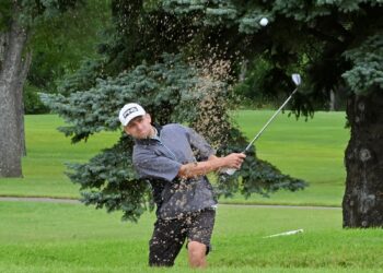 Aberdeen's Cramer Johnson hits out of the bunker on the par-five 18th hole during the Western Pro-Am Sunday, July 20 at Moccasin Creek Country Club. Johnson birdied the hole, but finished second in the amateur gross division. Aberdeen Insider photo by Robb Garofalo.