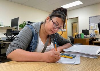 Future funding uncertainty worry directors of adult education programs in SD 3 Autumn Tree Top works on a math problem on July 17 at the Career Learning Center of the Black Hills in Rapid City. South Dakota Searchlight photo by Seth Tupper.