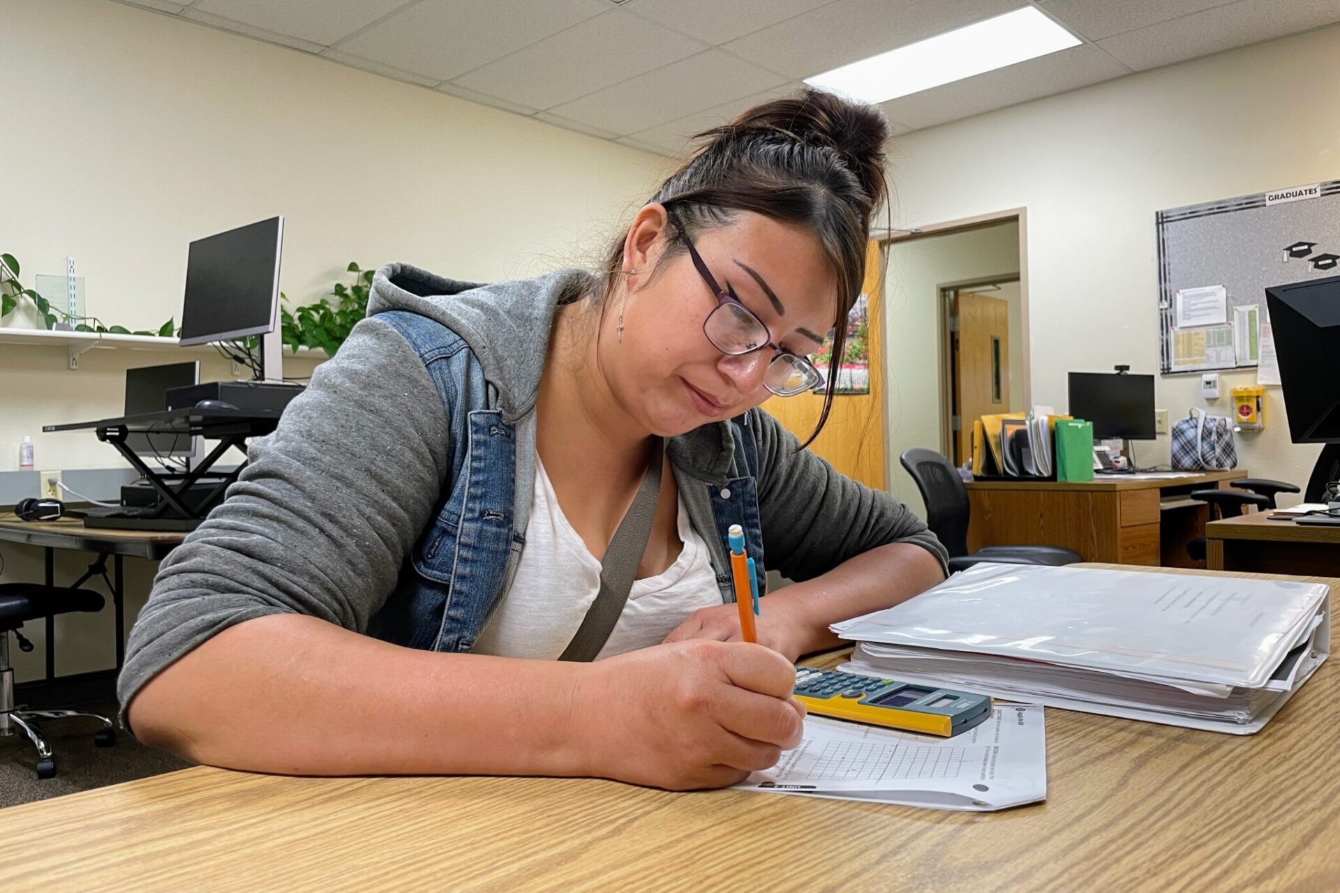 Autumn Tree Top works on a math problem on July 17 at the Career Learning Center of the Black Hills in Rapid City. South Dakota Searchlight photo by Seth Tupper.