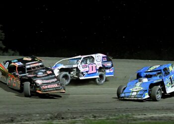 Landyn Rant (11) of Siren, Wis., hits and spins out Watertown's Todd Stark during the Dacotah Rumble Midwest Modifieds feature Friday, July 25 at Brown County Speedway. Dawson Zabel (1) avoided the collision and won the race. Aberdeen Insider photo by Robb Garofalo.